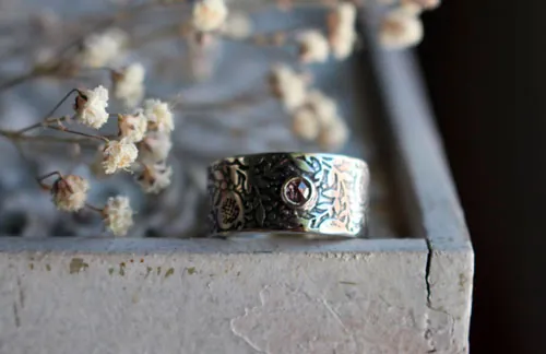 Eternité, bague grenade en argent et diamant
