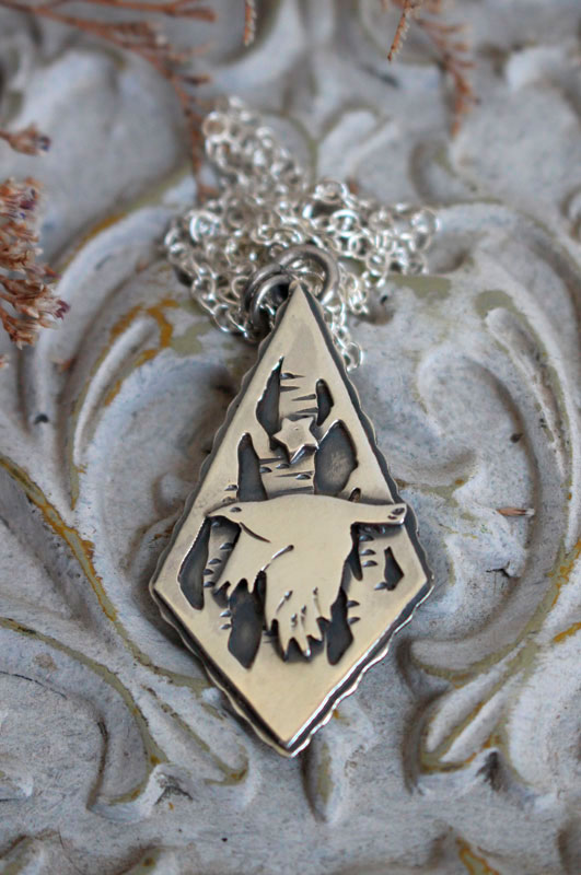 Instinct, collier corbeau et étoile en argent