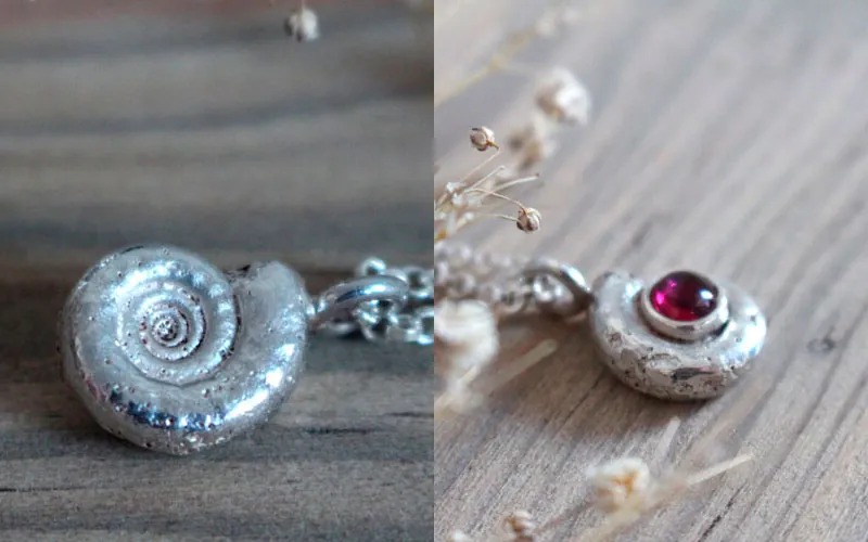 Le berceau de la vie, collier nautilus Ammonite et pierre de naissance en argent et rubis