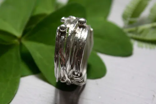 Les racines du hasard, bague tissage du fil de la vie grec en argent