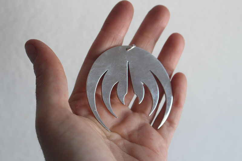 Magma deluxe, pendentif logo de groupe de rock en argent