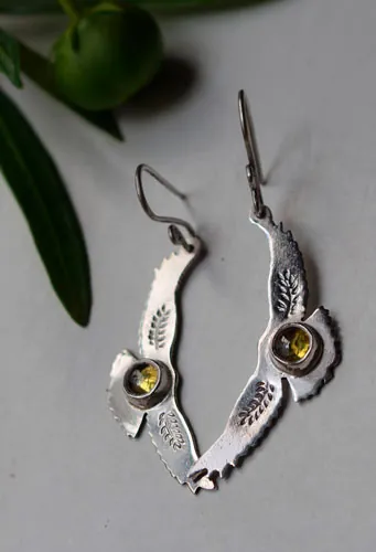 Ode au soleil, boucles d’oreilles aigle amérindien en argent et zircon jaune